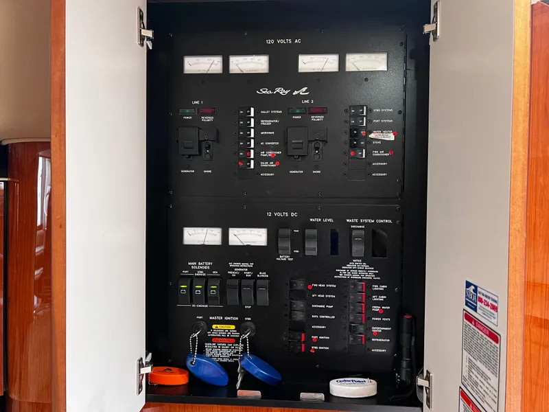 Slide: The Image of Electrical control panel inside a 2000 Sea Ray 380 Sundancer boat. - 27