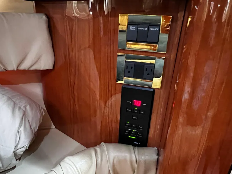 Slide: The Image of Control panel and outlets on 2000 Sea Ray 380 Sundancer yacht interior. - 32