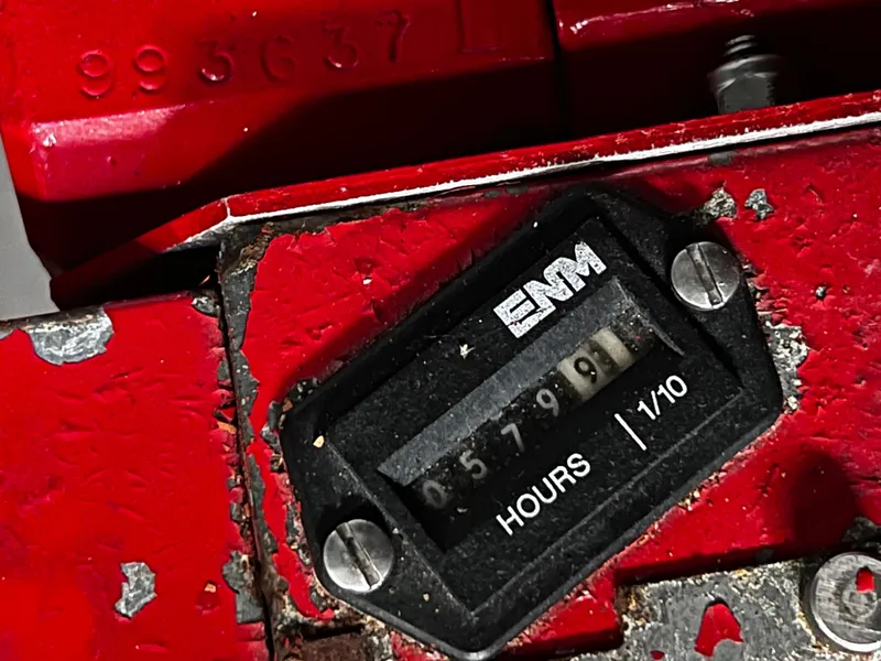 Slide: The Image of Hour meter reading 5799 on a red Sea Ray 380 Sundancer, year 2000. - 38