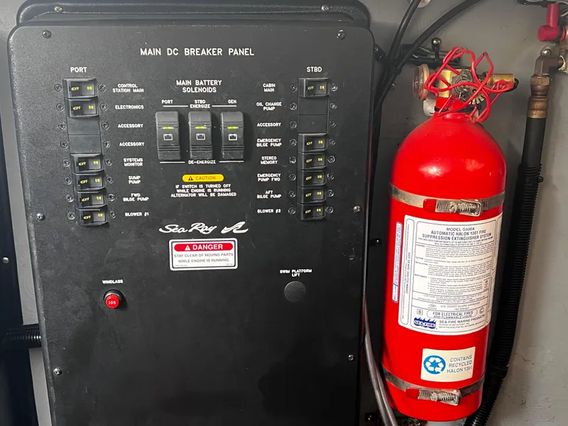 Slide: The Image of Main DC breaker panel and fire extinguisher on 2000 Sea Ray 380 Sundancer boat. - 39