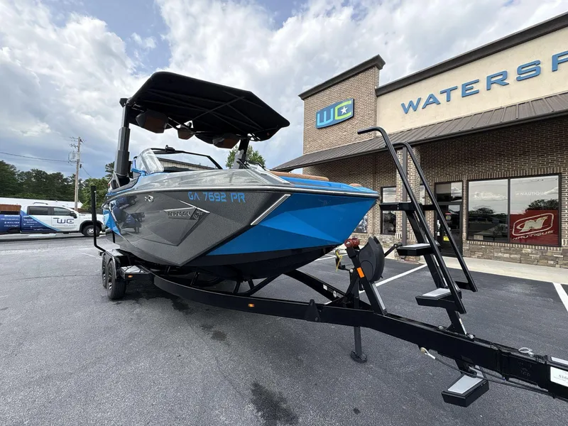Slide: The Image of 2021 Nautique Super Air Nautique G23 Paragon boat on trailer outside dealership. - 10