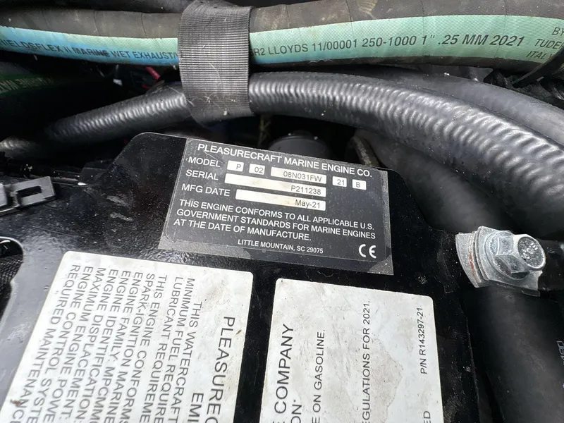 Slide: The Image of Engine label of 2021 Nautique Super Air Nautique G23 Paragon, showing model and manufacturing details. - 13