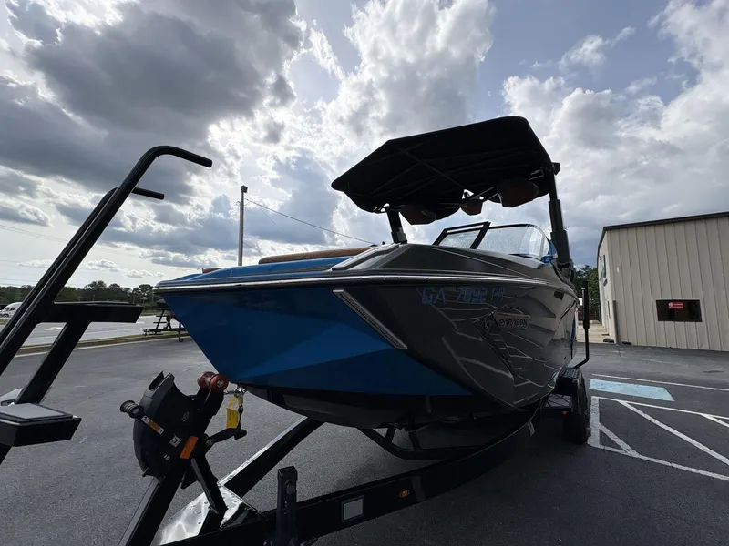 Slide: The Image of 2021 Nautique Super Air Nautique G23 Paragon on trailer under cloudy sky. - 2