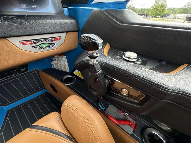Slide: The Image of Interior of 2021 Nautique Super Air Nautique G23 Paragon boat cockpit with controls. - 26