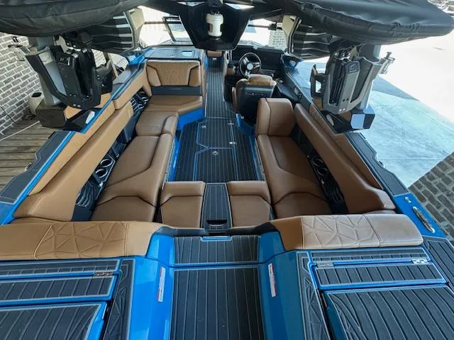 Slide: The Image of 2021 Nautique Super Air Nautique G23 Paragon interior with blue and brown seating. - 34