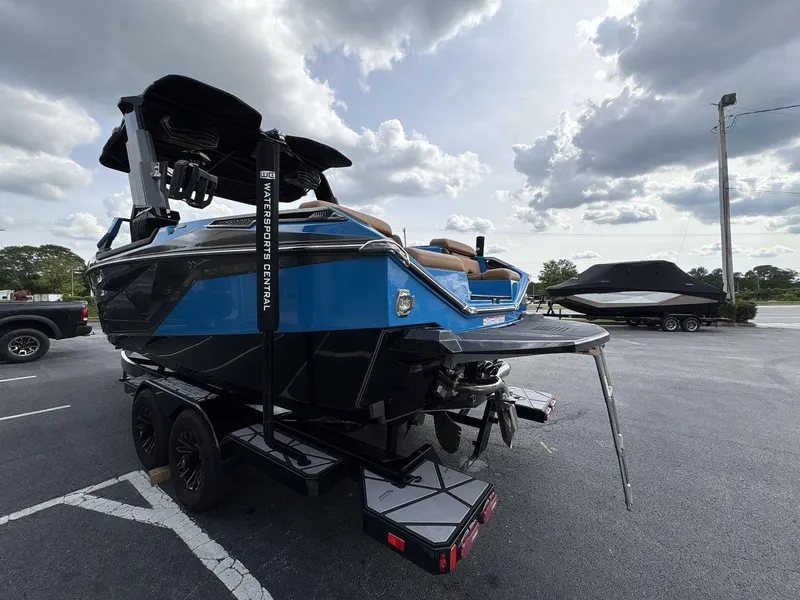Slide: The Image of 2021 Nautique Super Air Nautique G23 Paragon boat on trailer, parked outdoors. - 4