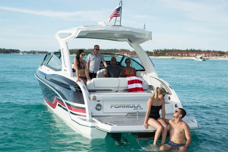 Slide: The Image of 2020 Formula 330 Crossover Bowrider with people enjoying the water. - 40