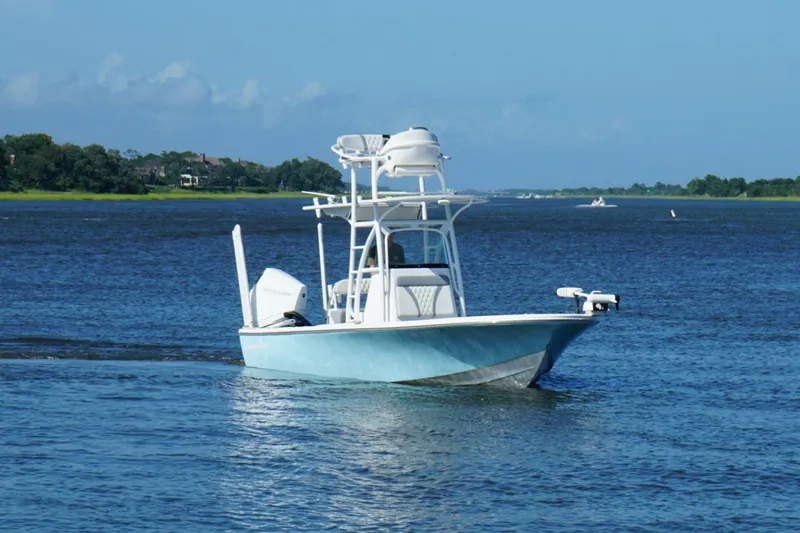 Slide: The Image of 2020 Canyon Bay 24H boat cruising on a calm blue lake. - 17