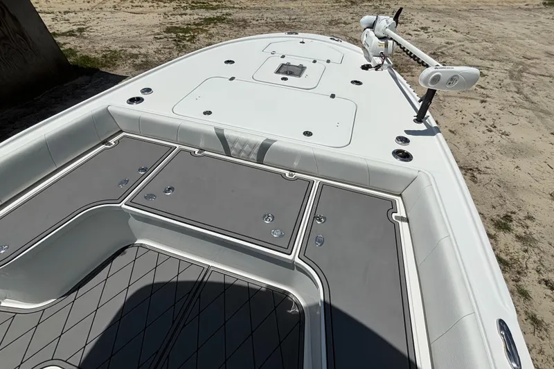 Slide: The Image of 2020 Canyon Bay 24H boat deck with storage compartments and trolling motor. - 28