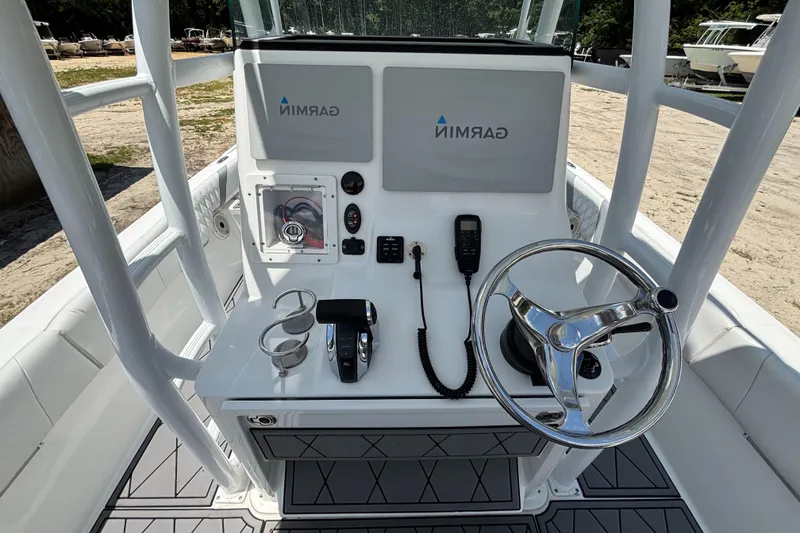Slide: The Image of Canyon Bay 24H boat console with Garmin displays and steering wheel, 2020 model. - 32