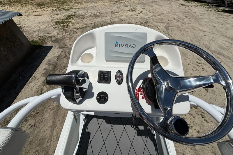 Slide: The Image of Canyon Bay 24H 2020 boat console with Garmin display and steering wheel. - 33