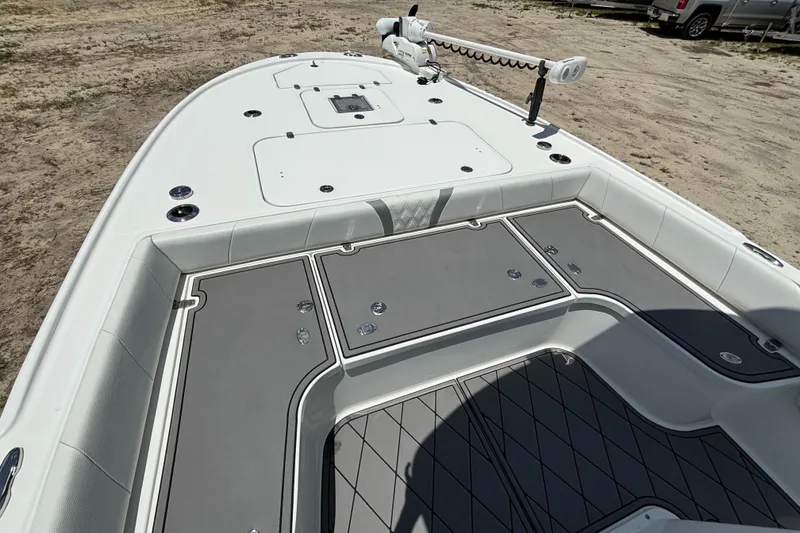 Slide: The Image of 2020 Canyon Bay 24H boat deck with storage compartments and trolling motor. - 34