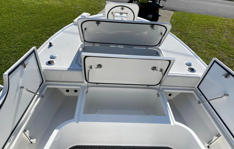 Slide: The Image of 2020 Canyon Bay 24H boat with open storage compartments on deck. - 4