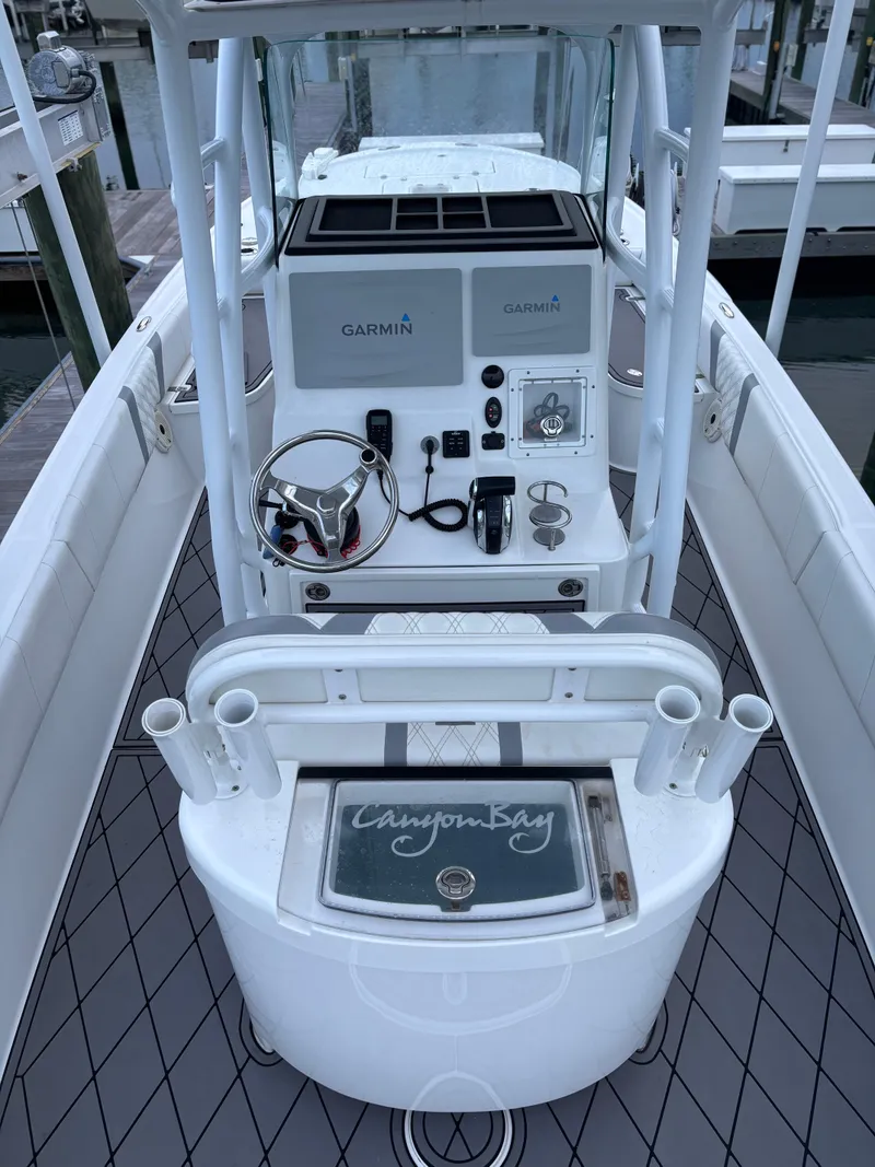 Slide: The Image of Canyon Bay 24H boat console with Garmin electronics, 2020 model, docked at marina. - 9