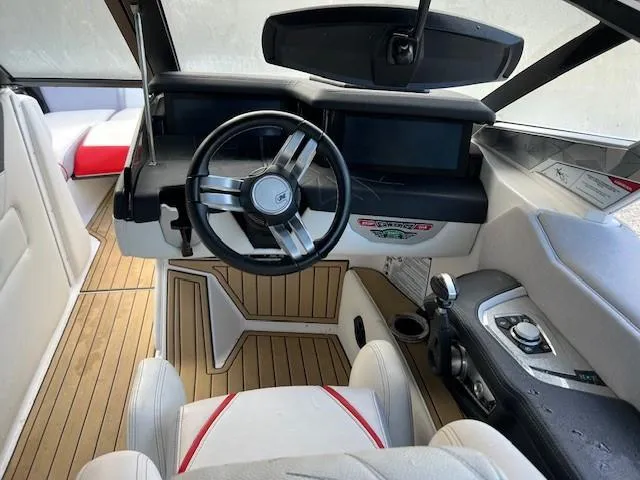 Slide: The Image of 2021 Nautique Super Air Nautique G23 Paragon cockpit with modern steering and controls. - 3