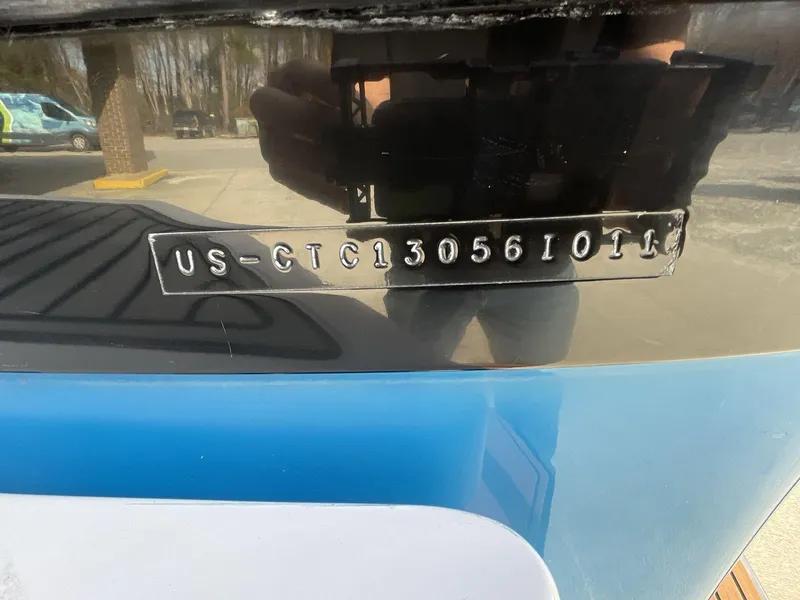 Slide: The Image of 2011 Nautique Super Air Nautique 230 hull identification number on boat exterior. - 10