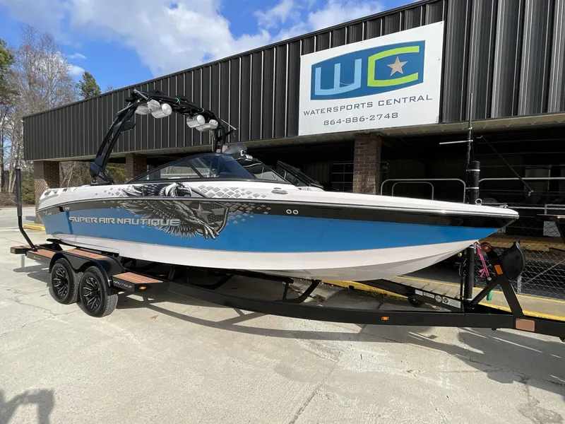 Slide: The Image of 2011 Nautique Super Air Nautique 230 boat on trailer at Watersports Central. - 16