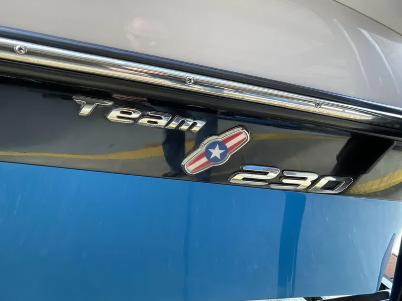 Slide: The Image of 2011 Nautique Super Air Nautique 230 boat emblem with "Team 230" logo. - 17