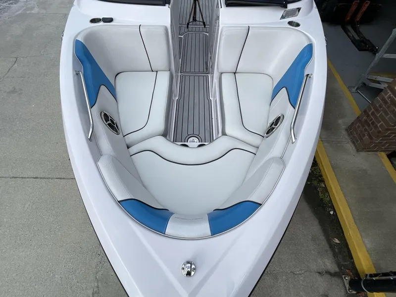 Slide: The Image of 2011 Nautique Super Air Nautique 230 boat interior with white and blue seating. - 31
