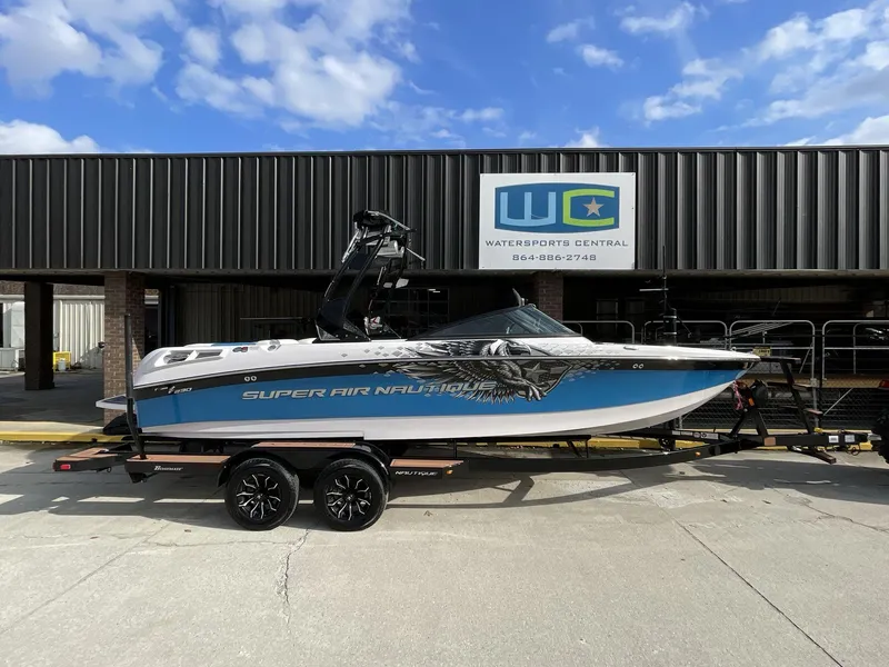 Slide: The Image of 2011 Nautique Super Air Nautique 230 boat on trailer at Watersports Central. - 9
