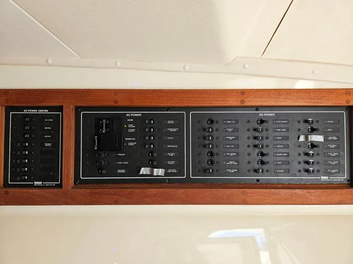Slide: The Image of Electrical control panel on a 2001 Carolina Classic Express 35 boat. - 16