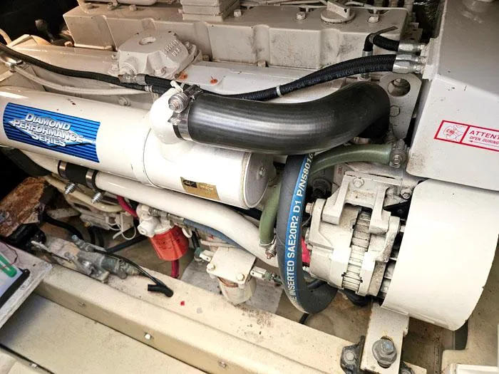 Slide: The Image of Engine of a 2001 Carolina Classic Express 35 boat, showcasing mechanical components. - 23