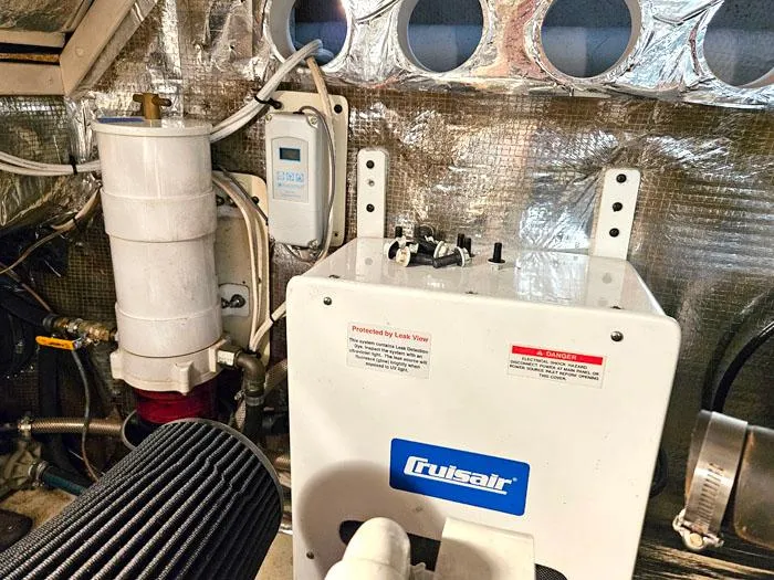 Slide: The Image of Engine room of 2001 Carolina Classic Express 35 with Cruisair unit and equipment. - 25