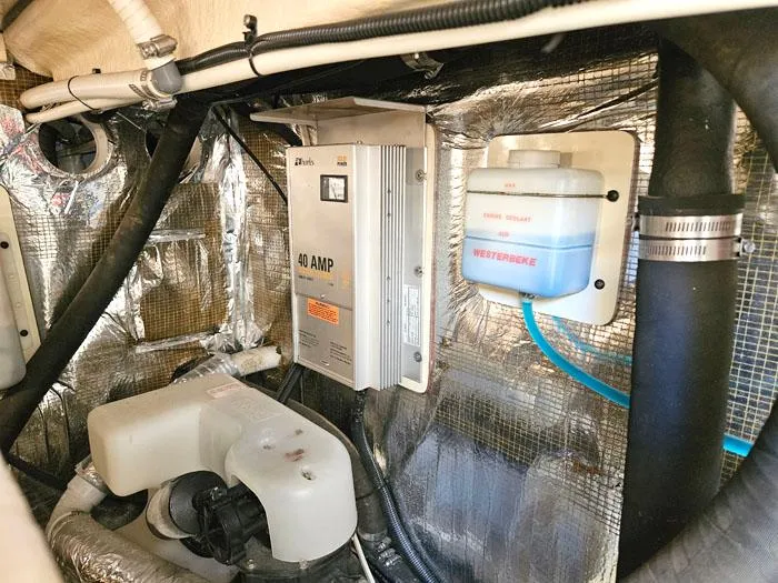 Slide: The Image of Engine room of 2001 Carolina Classic Express 35 with electrical and cooling components. - 26