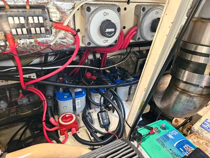 Slide: The Image of Engine room of 2001 Carolina Classic Express 35 with wiring and battery setup. - 27