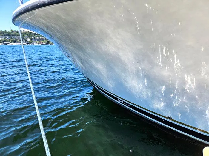 Slide: The Image of Bow of a 2001 Carolina Classic Express 35 boat on water. - 3