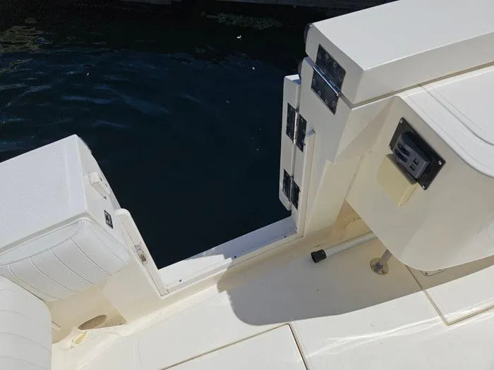 Slide: The Image of 2001 Carolina Classic Express 35 boat deck with seating and storage compartments. - 5