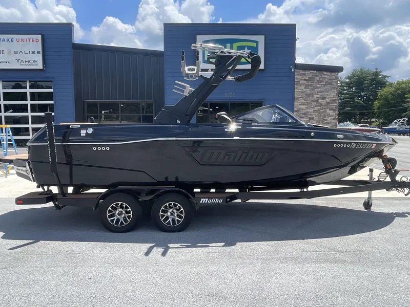 Slide: The Image of 2022 Malibu Wakesetter 23 LSV boat on trailer, parked outside dealership. - 10