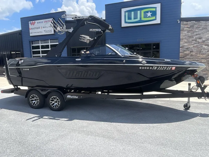 Slide: The Image of 2022 Malibu Wakesetter 23 LSV boat on trailer, parked outside dealership. - 11