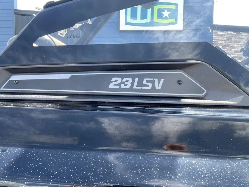 Slide: The Image of 2022 Malibu Wakesetter 23 LSV boat detail with logo and metallic finish. - 12