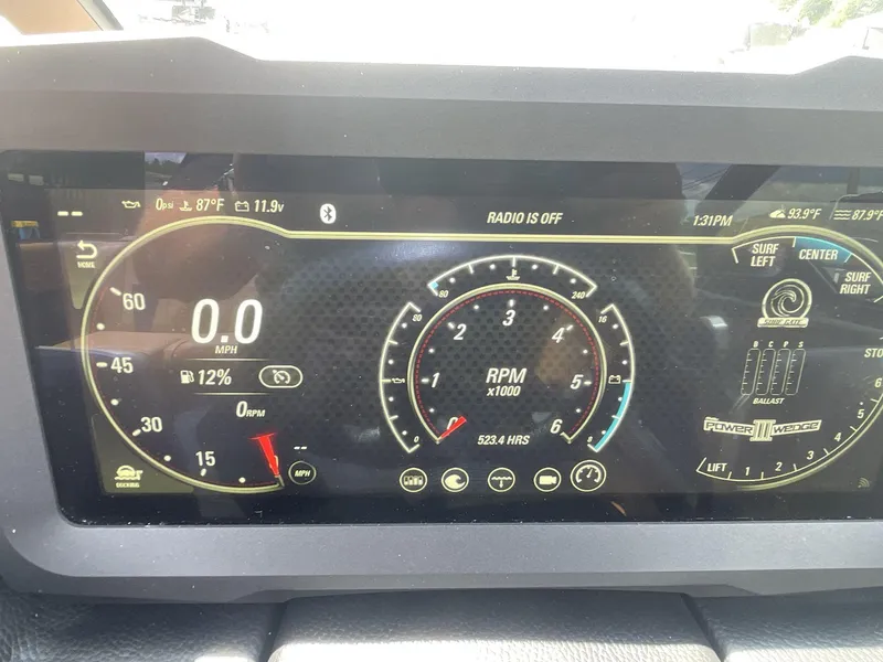 Slide: The Image of Dashboard of a 2022 Malibu Wakesetter 23 LSV showing speed, RPM, and settings. - 15