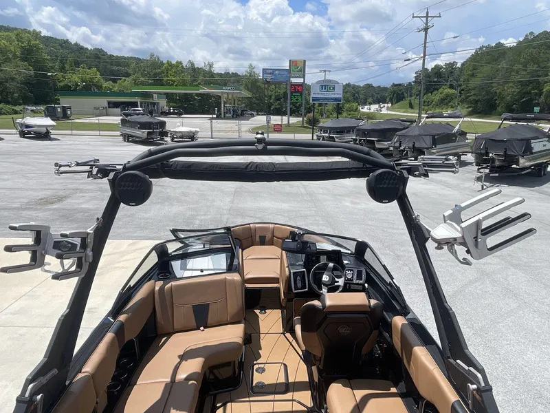 Slide: The Image of 2022 Malibu Wakesetter 23 LSV interior with tan seating, parked at dealership. - 17
