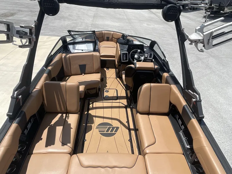 Slide: The Image of 2022 Malibu Wakesetter 23 LSV interior with tan leather seating and sleek design. - 20