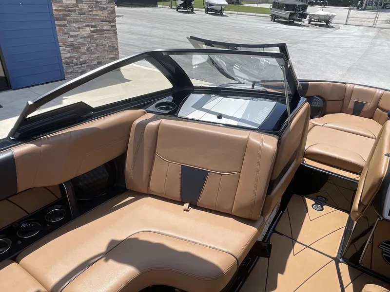 Slide: The Image of 2022 Malibu Wakesetter 23 LSV interior with tan leather seating and sleek design. - 22