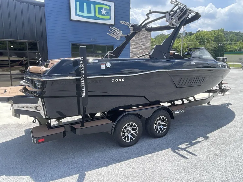 Slide: The Image of 2022 Malibu Wakesetter 23 LSV boat on trailer, parked outside dealership. - 9