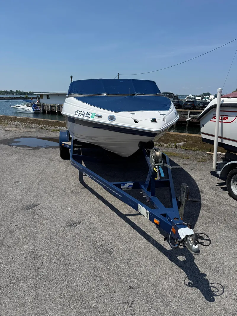 Slide: The Image of 2007 Crownline 19SS boat on trailer at marina, sunny day. - 3