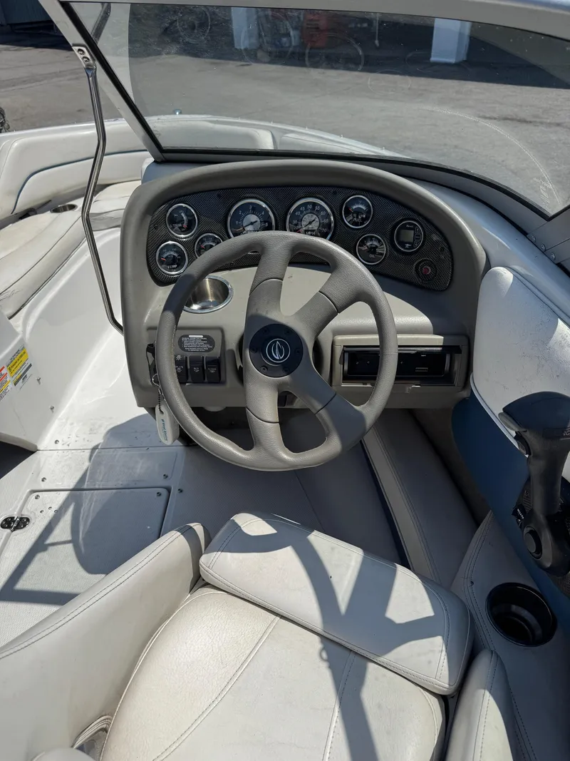 Slide: The Image of 2007 Crownline 19SS boat dashboard with steering wheel and instrument panel. - 5