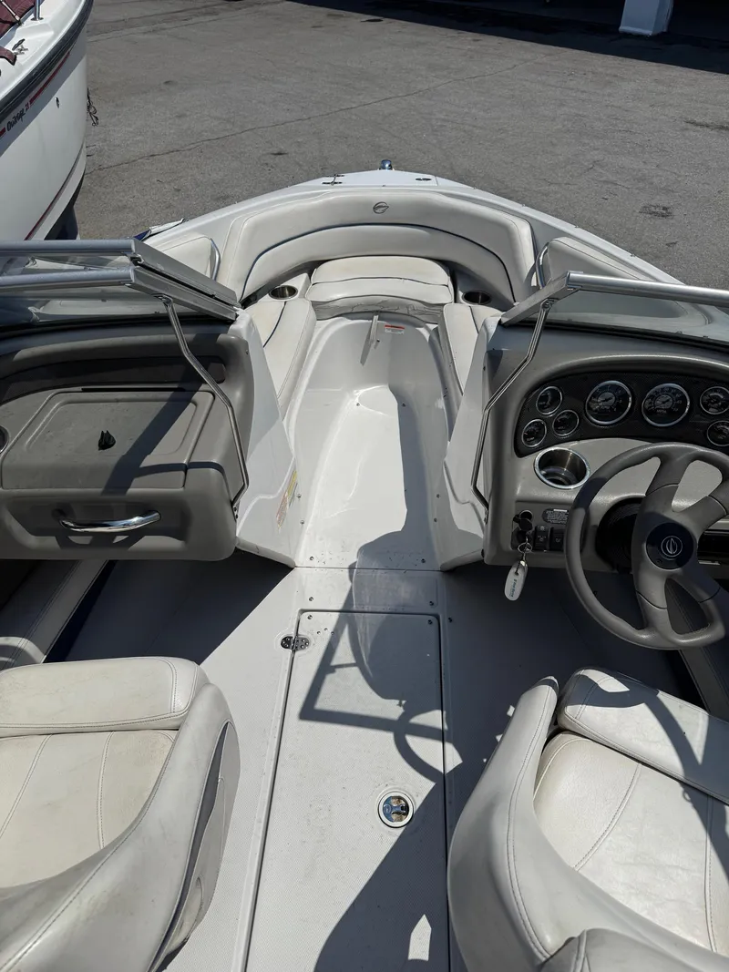 Slide: The Image of 2007 Crownline 19SS boat interior with steering wheel and seating area. - 7