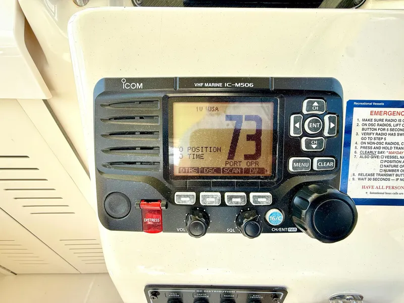 Slide: The Image of VHF marine radio on 2018 Grady-White Marlin 300 boat dashboard. - 11