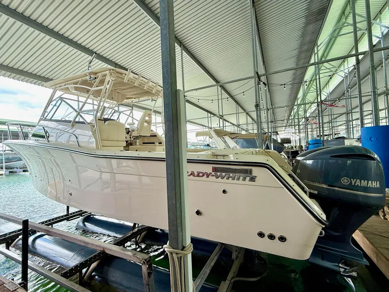 Slide: The Image of 2018 Grady-White Marlin 300 boat docked with Yamaha engines. - 13