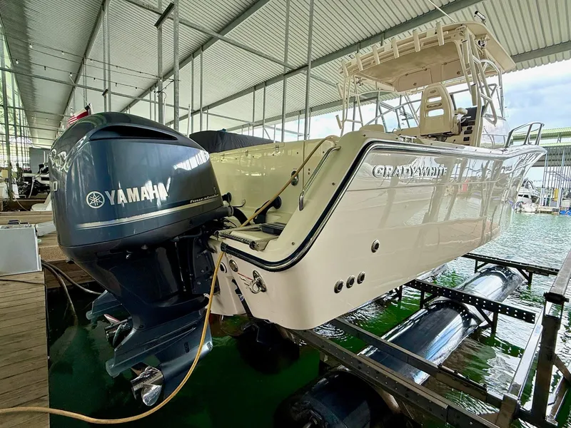 Slide: The Image of 2018 Grady-White Marlin 300 boat with Yamaha engine in marina. - 17