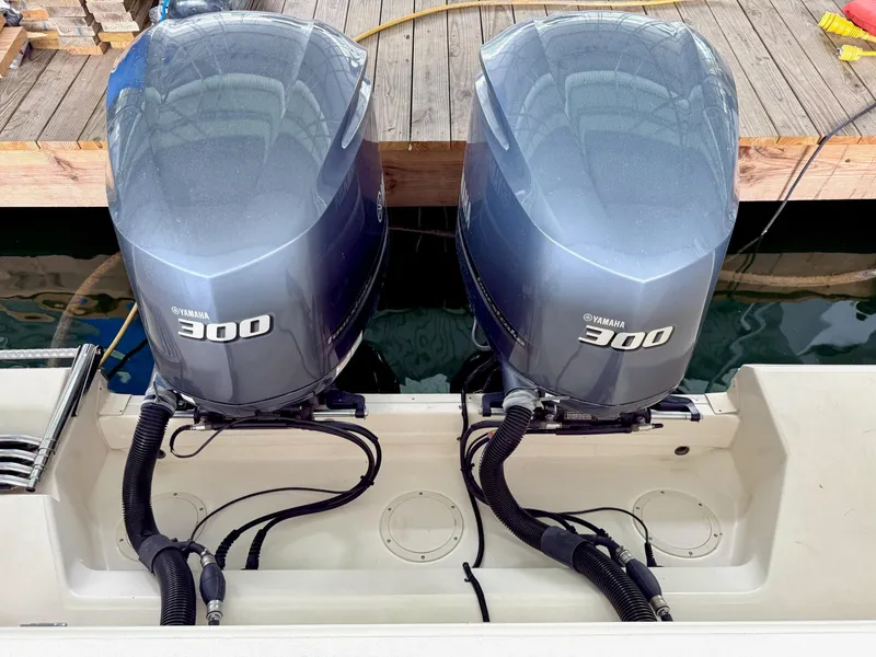 Slide: The Image of Twin Yamaha 300 outboard engines on a 2018 Grady-White Marlin 300 boat. - 19