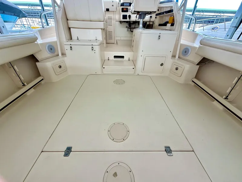 Slide: The Image of 2018 Grady-White Marlin 300 boat interior, featuring spacious deck and seating area. - 21