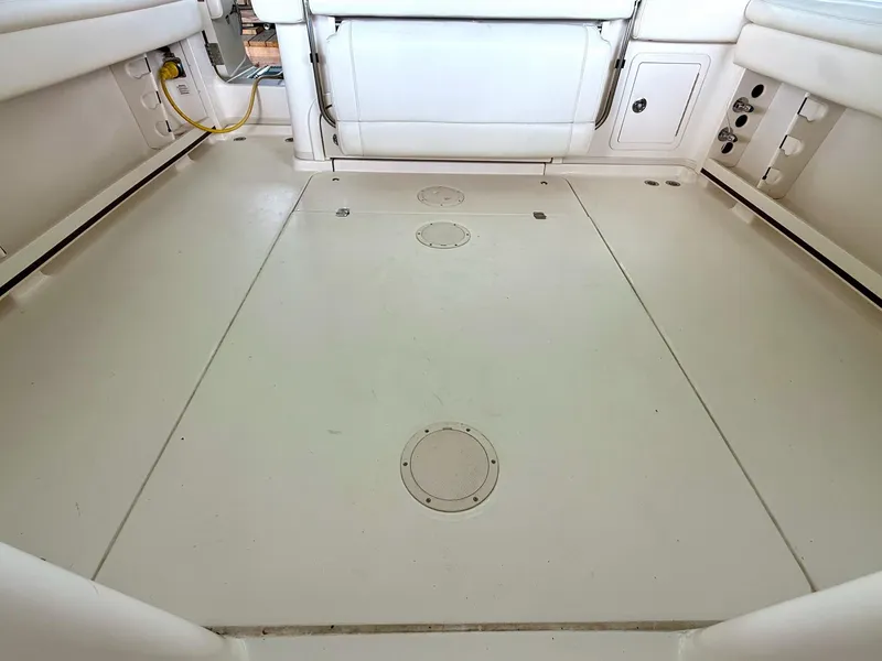 Slide: The Image of 2018 Grady-White Marlin 300 boat interior, showcasing spacious deck and storage compartments. - 22