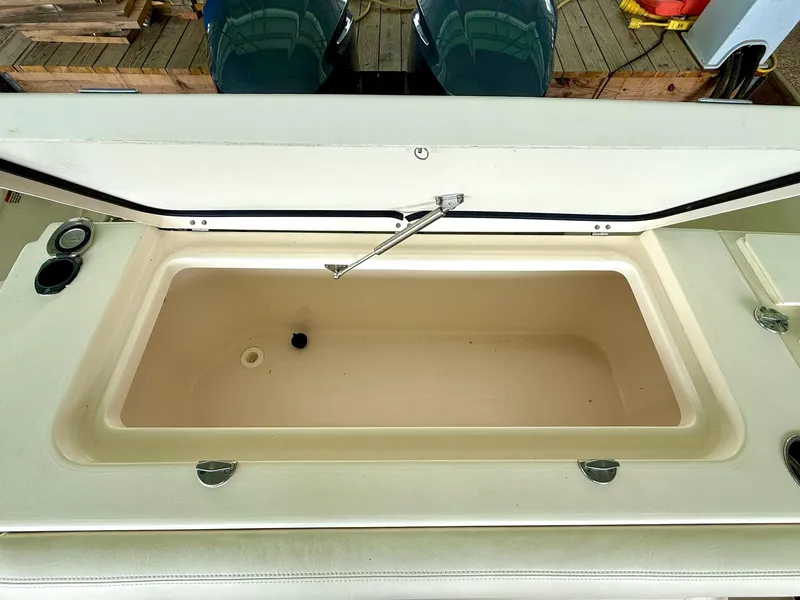 Slide: The Image of Open storage compartment on a 2018 Grady-White Marlin 300 boat. - 29
