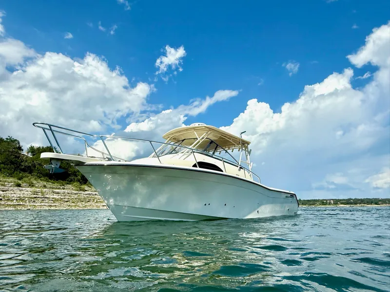 Slide: The Image of 2018 Grady-White Marlin 300 boat on water under blue sky. - 3